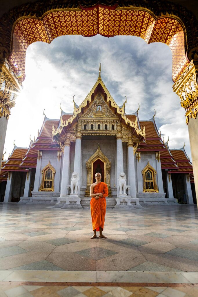 Buddhist monk in front of temple
